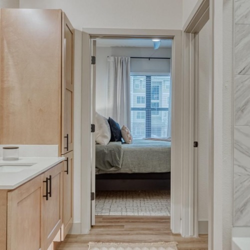 a person lying on a bed in a bathroom
