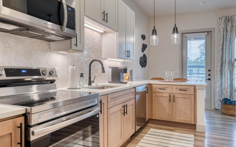 a kitchen with a stove and oven