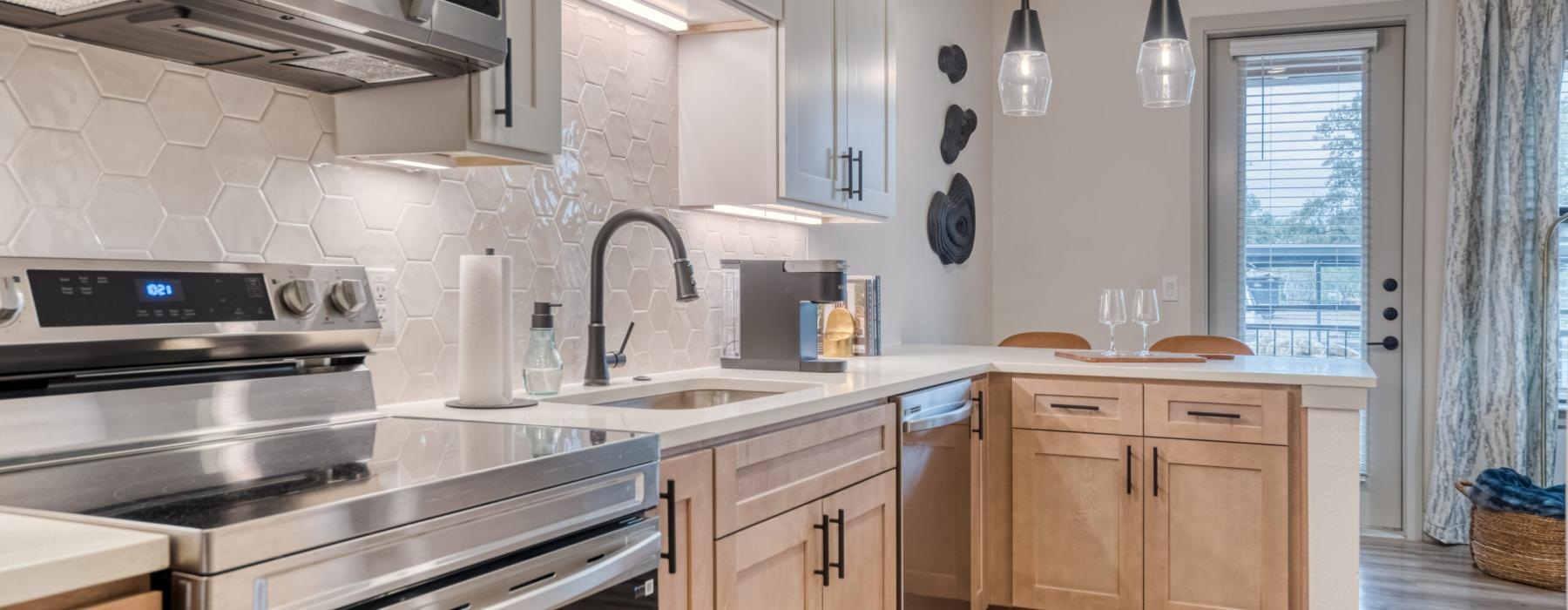 a kitchen with a stove and oven